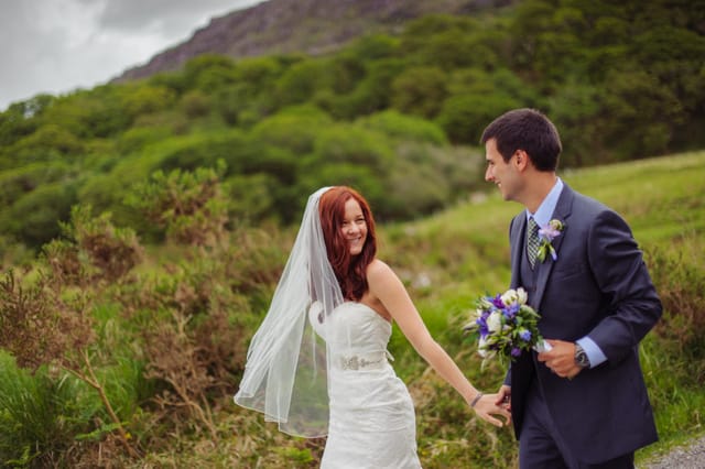 man and wife holding hands outside Love in Killarney 