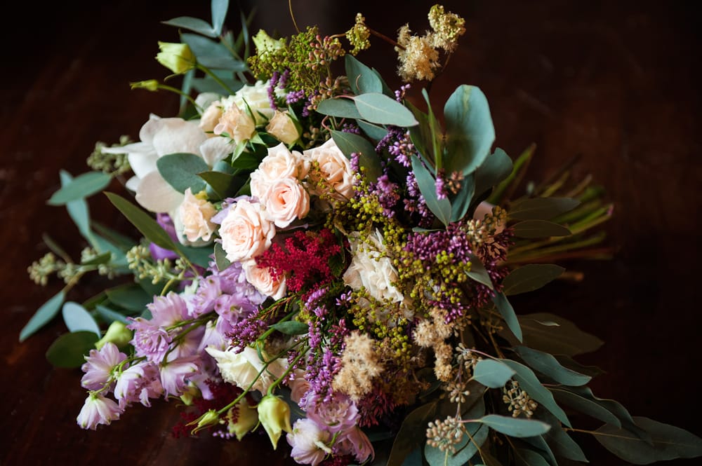 mixed loose wild bouquet garden roses eucalyptus 