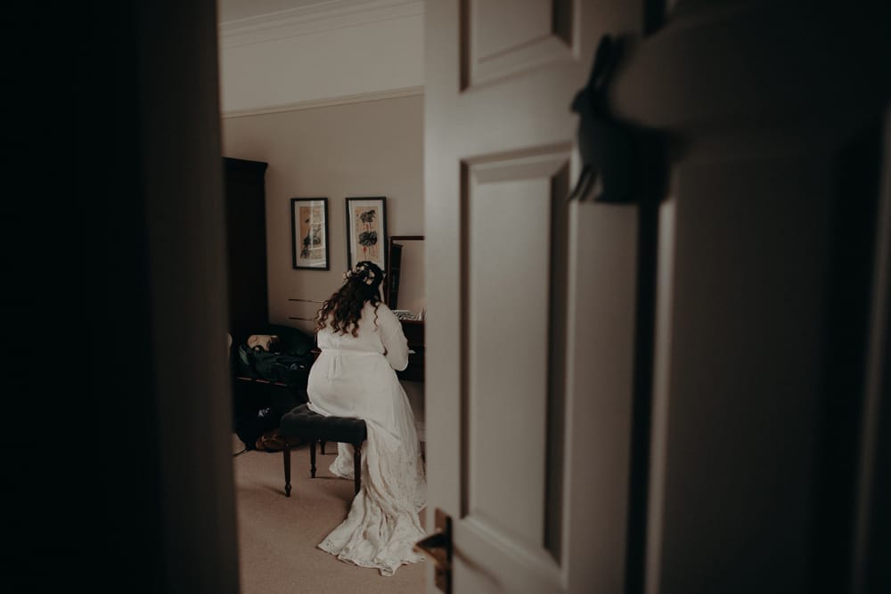 Moody Dreamy Elopement bride writing a note to groom 