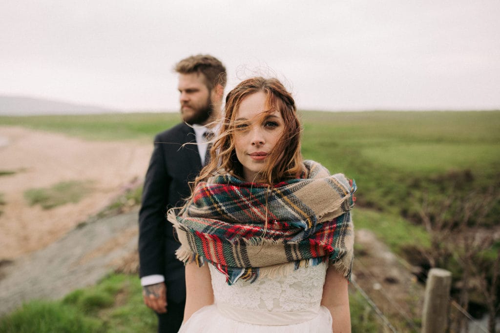 A Coastal intimate Wedding in Ireland here the bride looks in to the camera 